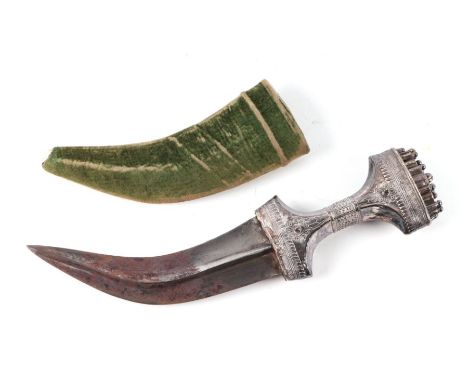 A Middle Eastern Jambiya dagger with white metal handle, 30cms long.Condition ReportThe blade is heavily corroded on both sid