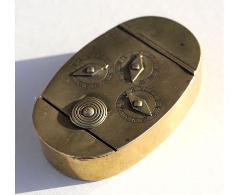 A Georgian brass oval combination snuff box, the lid with three dials, 8cm by 5cm. (combination 5-4-7)