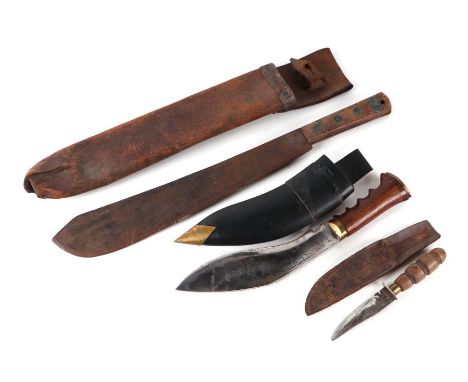 A WWI machete in leather scabbard, 53cms long; together with a kukri with hardwood handle, in scabbard, 36cms long; and a she