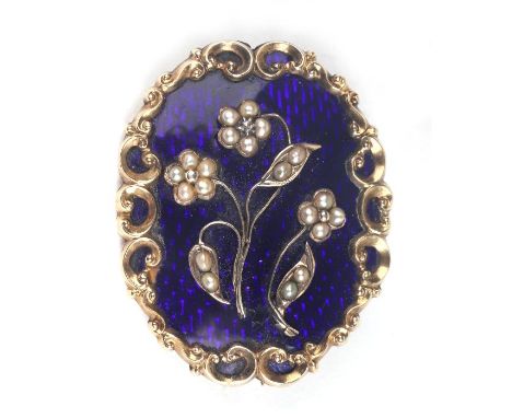 An early Victorian yellow metal mounted memorial brooch with blue enamel and pearl set flowers and locket back, 33mm by 42mm.