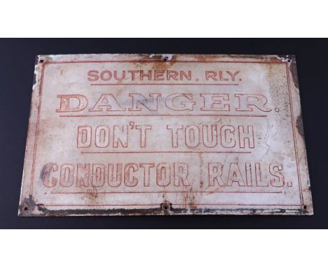 A Southern Railways enamel information sign 'Danger Don't Touch Conductor Rails', 51cms wide.Condition ReportThe surface has 