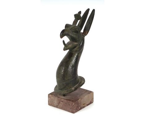 A Grand Tour bronze griffin head in the 7th century BC manner, taken from a cauldron, mounted on a marble base, 26cms high.