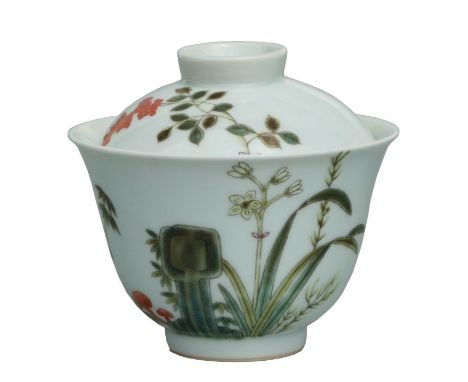 A Chinese cup and cover decorated with bats and foliage, 9cms diameter.
