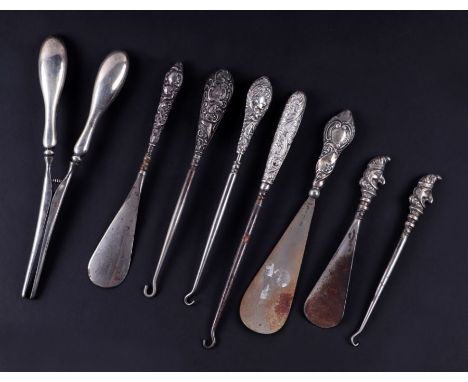 A late Victorian novelty silver handled button hook in the form of Mr Punch; together with a matching shoe horn, Birmingham 1