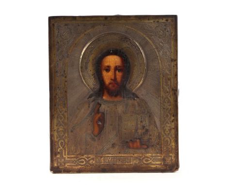 A Russian icon, oil on wooden panel within a pierced brass mount, 15 by 18cms.