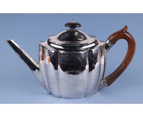 A George III silver teapot, London 1798 and maker's mark for Abraham Taylor, 16cms high, 444g.