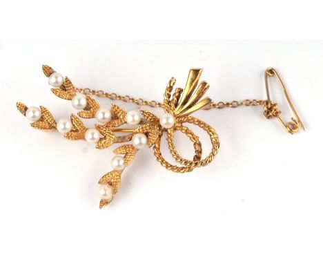 A 9ct gold pearl set foliate spray brooch with safety chain, 4.5cms wide, 7.9g.