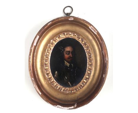 A 17th century oval portrait miniature depicting a gentleman in armour, painted on copper, in an oval gilt gesso frame, 6 by 