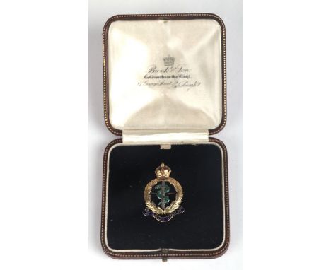A high carat gold (unmarked but tested) Army Medical Corp sweetheart brooch with enamel decoration, in a fitted leather box, 