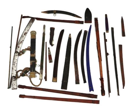 A large quantity of assorted sword and dagger scabbards, sheath fittings, antique gun parts, barrels and other items containe