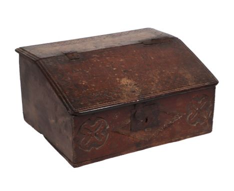 A 17th century oak bible box, the front panel carved with lunettes, 62cms wide.