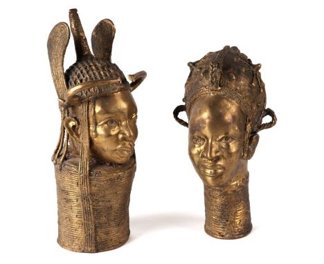 A pair of African tribal gilded cast bronze figural staff heads, each approx 35cms high (2).