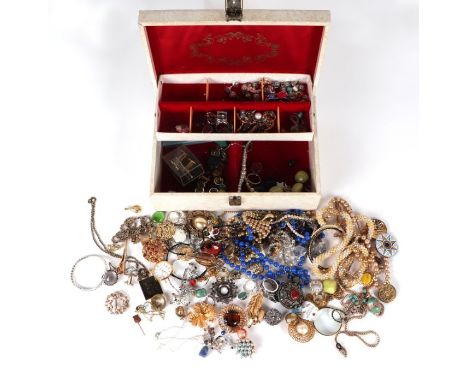 A quantity of costume jewellery to include brooches and necklaces, in a white jewellery box.