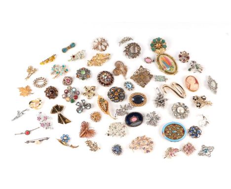 A large quantity of vintage costume jewellery brooches.