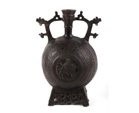 A Balkan pewter flask cast with Nuremburg Prince Elector on Horseback and dragons head spouts, possibly 16th century, 27cms h