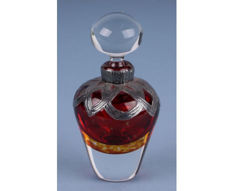 A Bohemian ruby cased glass overlaid silver scent bottle and stopper with import marks, 9cms high.