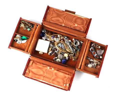 A quantity of costume jewellery in a faux crocodile skin leather jewellery box.