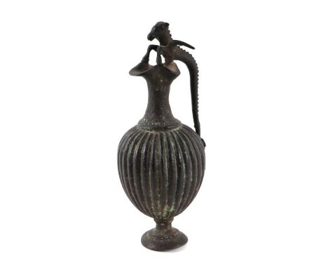 A Grand Tour bronze ewer with dragon handle, 16cms high.