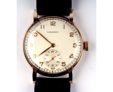 A Longines 9ct gold gentleman's wristwatch, the silvered dial with Arabic numerals and subsidiary seconds dial at 6 o' clock,