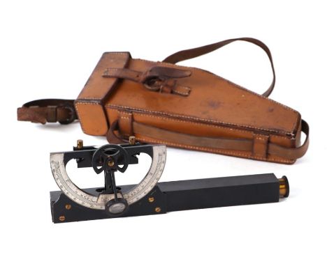 A lacquered brass clinometer, in leather case, 25cms long.