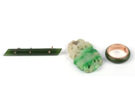 A 9ct gold mounted jade bar brooch; together with a yellow metal and jade ring, approx UK size 'L'; and a Chinese figured jad