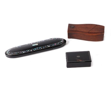 A novelty coffin shaped snuff box, 10cms long; together with a papier-mâché snuff box, 6cms long; and a mother-of-pearl inlai