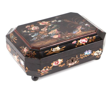 A late 19th century Japanese lacquered jewellery box decorated with chickens and flowers, of elongated octagonal form, the li