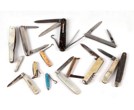 A group of pocket knives to include silver  and enamel examples. 