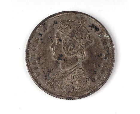 A Victorian silver Gothic mis-struck error coin, double headed, created when the first coin hadn't cleared the press before t