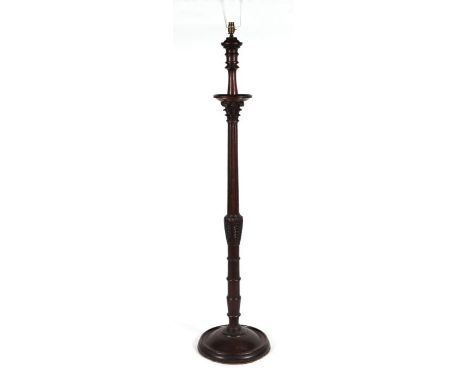 A carved and turned mahogany Corinthian column type standard lamp.