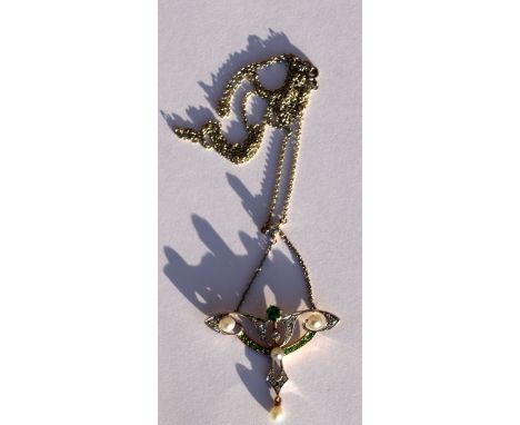 An Edwardian white metal and yellow gold, diamond, peridot  and pearl pendant drop necklace, in the form of a stylised butter