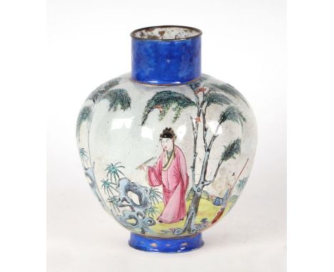 A Chinese Canton enamel on copper vase decorated with figures in a landscape, 25cms high.