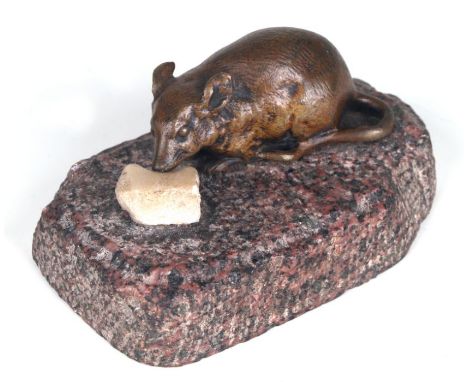 A French bronze figure of a mouse eating a lump of cheese on a figured pink granite base, 10cms wide.