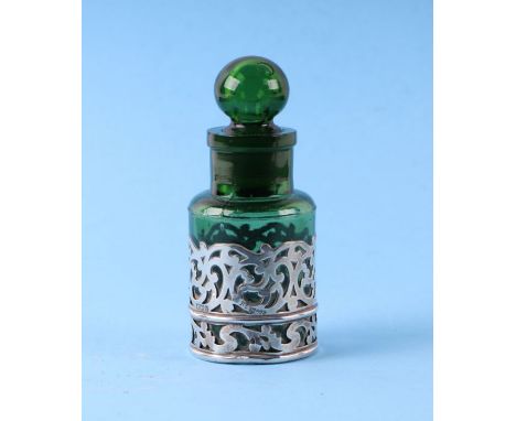 A first quarter 20th century green glass and overlaid silver smelling salt bottle, London 1923, 13cms high.