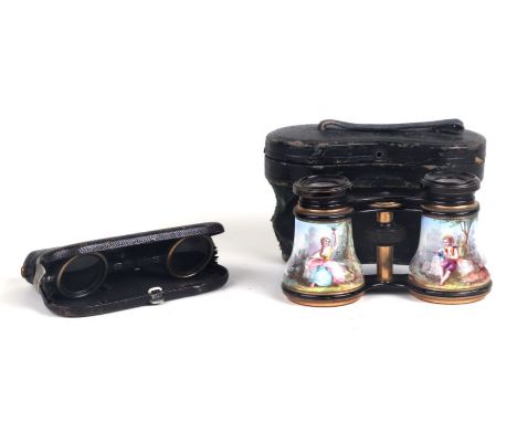 A pair of continental black lacquered brass and enamel opera glasses decorated with an 18th century couple, cased; together w