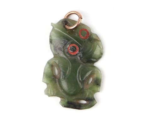 A New Zealand carved jade Hei-tiki form pendant.