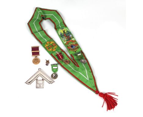 An Ancient Order of Foresters sash and jewels, one silver; together with similar items.