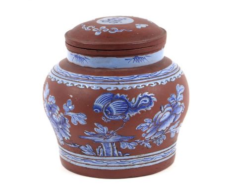 A Chinese Yixing tea caddy decorated with flowers, impressed character mark to base, approx 15cms diameter.
