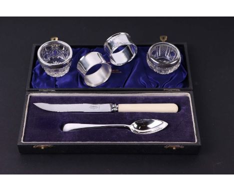 A George V Mappin &amp; Webb silver knife and fork christening set, 1929, cased; together with two silver napkin ring and two