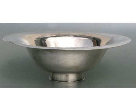 A Peter Muller-Munk hand wrought sterling silver flared bowl with planished finish, 989g, 32cms diameter.