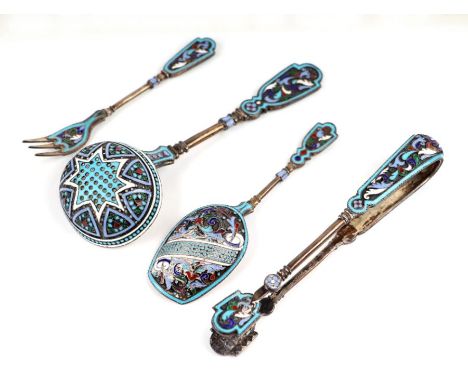 A suite of Russian silver and enamel tea implements to include sifter ladle, sugar tongs, shovel and a three-pronged fork.Con