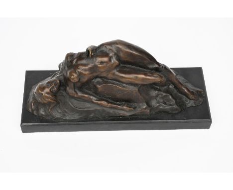 A patinated bronze model of a woman reclining over rocks, on polished black slate base, signed Noel. 32cm  wide, 14cm high