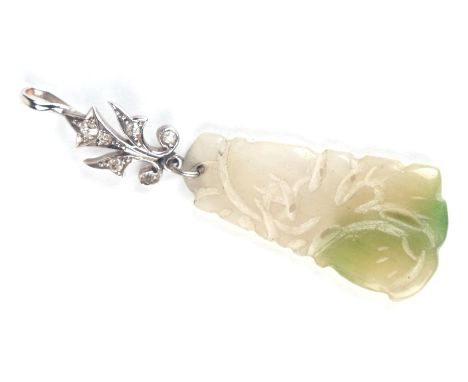 A Chinese pierced jade pendant int eh form of peaches, on a white metal diamond set suspension loop, 5.5cms high.