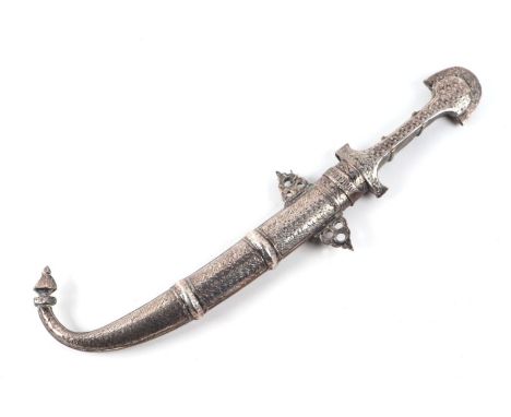 A Middle Eastern dagger, the white metal mounted hardwood handle with curved steel blade, in a white metal scabbard, 39cms lo