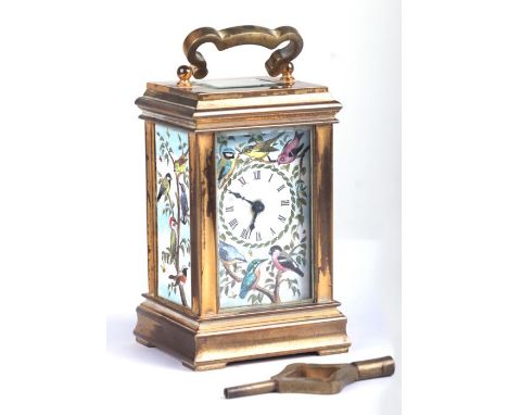 A miniature brass and enamel carriage time piece decorated with British birds and foliage, retailed by Deacon of Swindon, 8.5