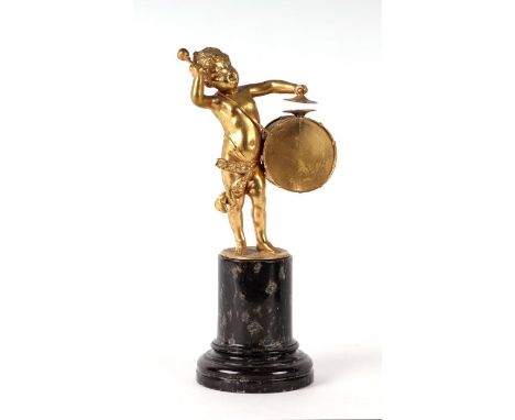 A gilt bronze figure depicting a putti playing a drum on a serpentine marble base, 25cms high.