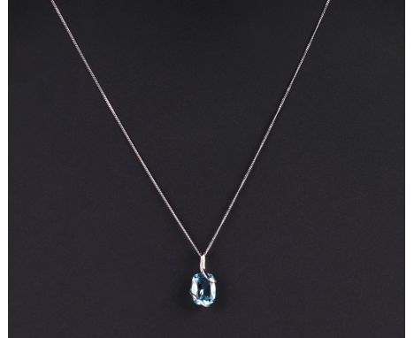A 9ct white gold aquamarine pendant on a fine gold chain.