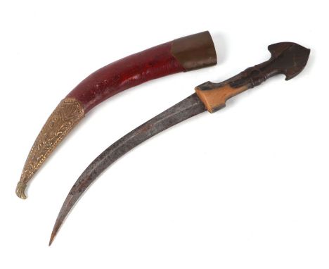 A Middle Eastern curved dagger with horn handle, in a brass mounted leather scabbard, 43cms long.