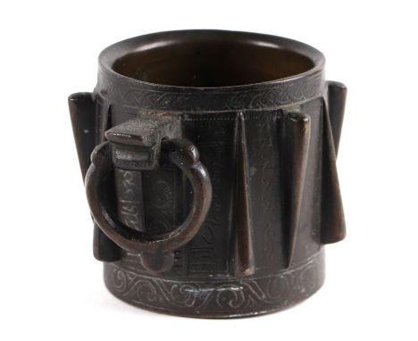 A heavy Spanish Hispano Moresque bronze mortar cast in the Islamic taste with angular lugs and single handle having Islamic s