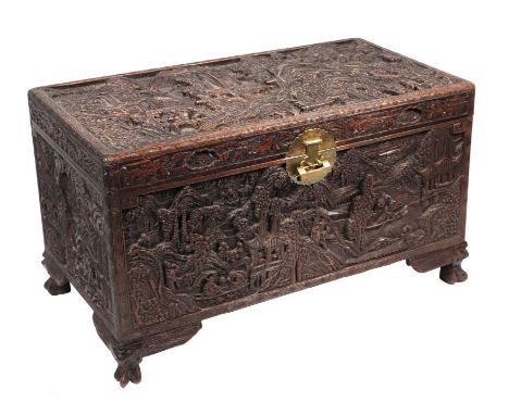 A Chinese profusely carved camphorwood trunk, 102cms wide.